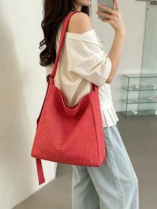 Large red and white plaid nylon shoulder bag with adjustable strap for casual daily use