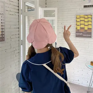 Back view of a pink Japanese style fisherman hat featuring feminine ruffle edge details