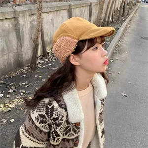 Profile view of a mustard yellow earflap hat with soft plush lining for winter warmth
