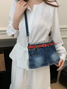Fashionable unique denim skirt style crossbody bag featuring a red belt detail for women