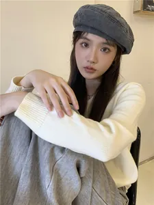 Vintage washed denim beret hat for women worn by a model showing a classic gray finish