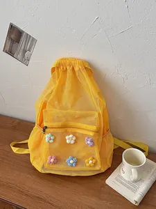 Stylish yellow mesh backpack with colorful 3D flowers, perfect for casual summer outings