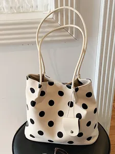French retro cream tote bag with stylish black polka dots and slim shoulder straps