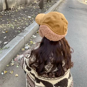 Back view of a warm winter trapper hat with soft sherpa lining and cozy ear flaps.