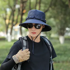 Close-up of navy blue outdoor bucket hat with adjustable chin strap for men