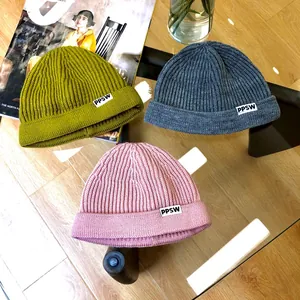 Children's ribbed knit miki hats in mustard, grey, and pink with PPSW label