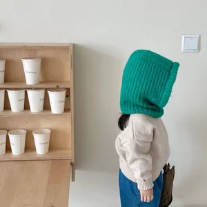 Cozy green knit balaclava for kids, warm winter hood scarf combo for young toddlers.