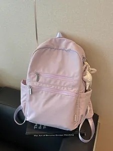 Mochila ligera de nailon color lavanda para mujer de estilo coreano con adorno de lazo