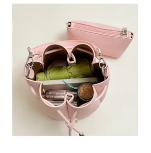 Top-down view of the pink bucket bag interior showing its spacious capacity for essentials.