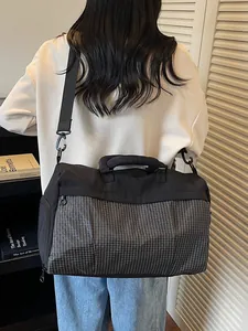 Large fashionable black grid travel shoulder bag designed for commuting and short business trips