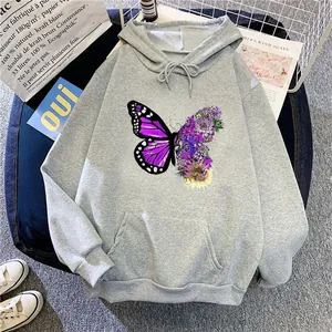 Close-up of oversized grey hoodie with purple butterfly floral graphic and kangaroo pocket.