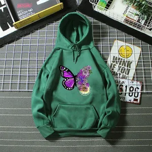 Full view detail of green hoodie showing the intricate butterfly and floral graphic print