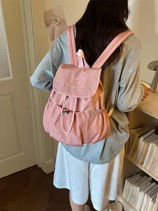 Stylish summer pink drawstring backpack for travel and school with pleated pockets