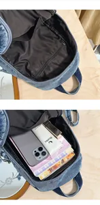Detail view of a denim backpack's interior with large storage capacity