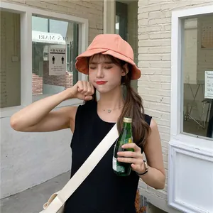 Pink ruffled bucket hat for women providing sun protection in a stylish Japanese design
