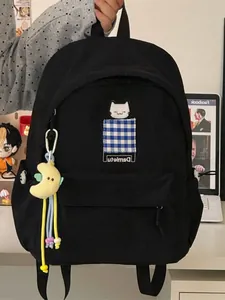 Japanese style black student backpack with cute cat embroidery and moon pendant