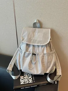 Stylish light grey drawstring pleated backpack with grid texture for student travel