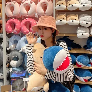 Cute peach bucket hat with rabbit ears embroidery worn by a model in a lifestyle setting