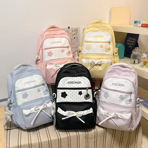 Adorable Korean style student backpacks featuring star patterns and bow tie details