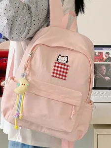 Pink minimalist Japanese student backpack with cute cat embroidery and moon charm