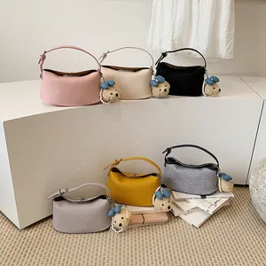 Elegant Korean style bucket bags in six colors featuring cute plush teddy charms.