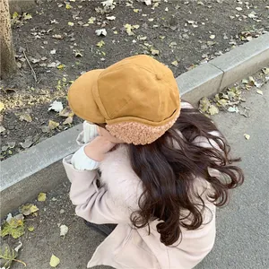 Detailed back view of a yellow winter earflap hat featuring soft beige fleece lining