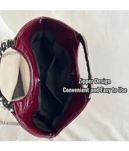 Macro detail view showing the black interior lining and silver wavy handle of this bag