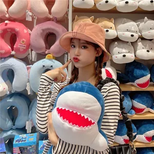 Girl wearing a cute pink bucket hat with bunny ears in a playful store setting