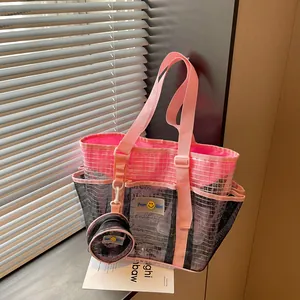Detailed view of large pink and black mesh tote bag with a small matching round pouch