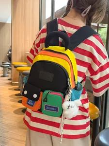 Vibrant multi-color patchwork backpack with large capacity for stylish travel and school use