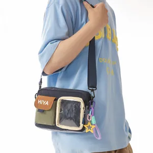 Model wearing a casual navy crossbody shoulder bag with multi-pocket design and star charm