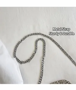 Detail shot of durable silver metal chain strap for women's crossbody bag
