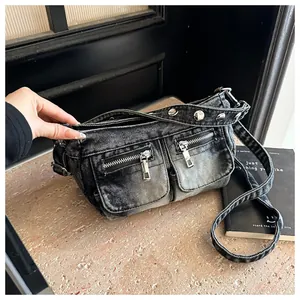 Detail view of retro washed denim crossbody bag featuring stylish silver-tone metal hardware