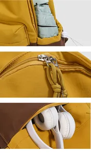 Detailed view of yellow backpack side pocket, zipper, and spacious main compartment.