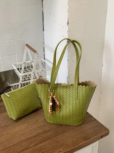 Large retro green woven bucket bag with matching pouch and stylish beaded tassel charm