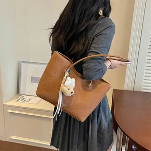 Chic large brown tote bag for women showcased in a casual and stylish lifestyle setting