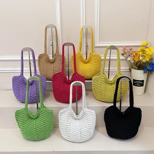 Colorful crochet shoulder bags displayed in multiple shades showing fine knit texture
