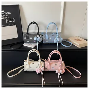 Detailed view of trendy animal print mini barrel bags in four stylish pastel colors