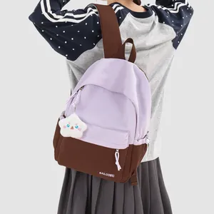 Two-tone lavender and brown school backpack for girls with a cute cloud plush star charm