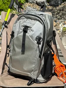 Lightweight silver waterproof hiking backpack for outdoor travel and camping use
