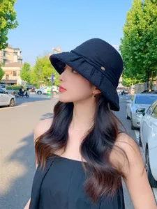 Elegant black breathable sun hat for women, foldable summer bucket hat for travel