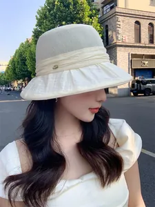Elegant breathable summer sun hat for women with pleated brim and decorative pin detail