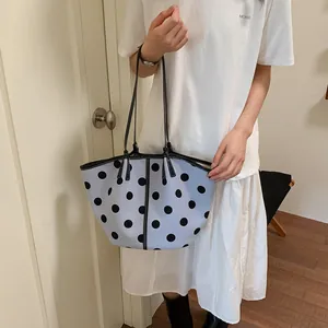 Chic light blue polka dot tote bag for women, stylish spring shoulder bag detail