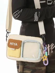 Casual unisex beige crossbody bag with transparent pocket and star charm detail