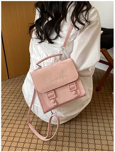 Close-up view of a pink sweet academy style shoulder bag featuring cute embroidered heart