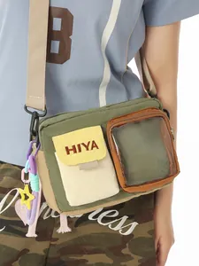 Casual sporty multi-color crossbody bag with transparent pocket and HIYA embroidery detail