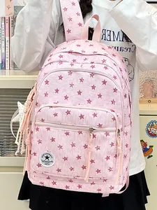 Pink student backpack with red star pattern and multiple zip compartments