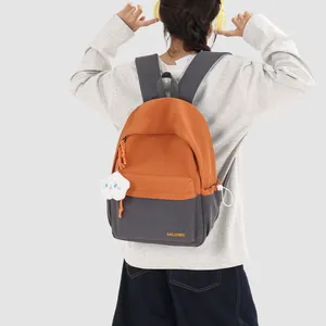 Academy style orange and grey lightweight school backpack shown on model back view