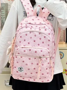 Close-up of pink star pattern backpack with multiple zipper pockets for students