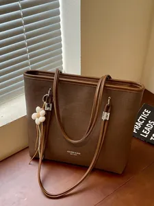 Brown textured large capacity tote bag for women with flower charm and shoulder strap